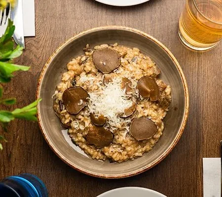 Creamy Arborio porcini mushroom risotto finished with aged Grana Padano cheese