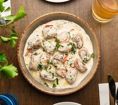 Artisan potato gnocchi stuffed with spicy beef in a velvety wild mushroom sauce